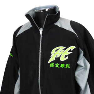 Black zip-up jacket with gray shoulder panels and a neon green logo and Asian characters on the left chest.