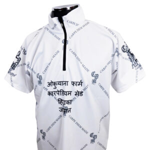 White windbreaker-style jacket with a black zipper and an all-over diagonal 'CARPE DIEM MADE' print and decorative motifs across the fabric.