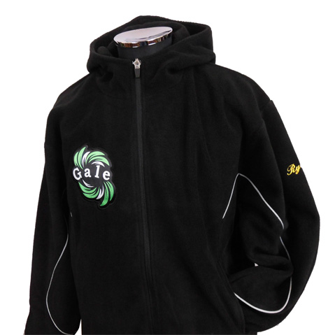 Black zip-up hoodie on a mannequin with a green circular logo on the left chest and yellow embroidery on the right sleeve.