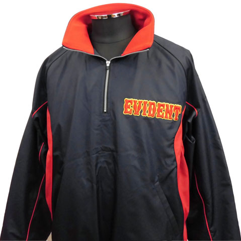 Black windbreaker with red trim and an embroidered 'EVIDENT' logo on the chest beneath a red collar edge.
