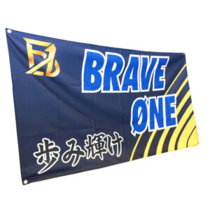 Flag-style banner with blue and yellow design reading BRAVE ONE, plus Japanese text at the bottom left, likely a promotional or branding banner.”