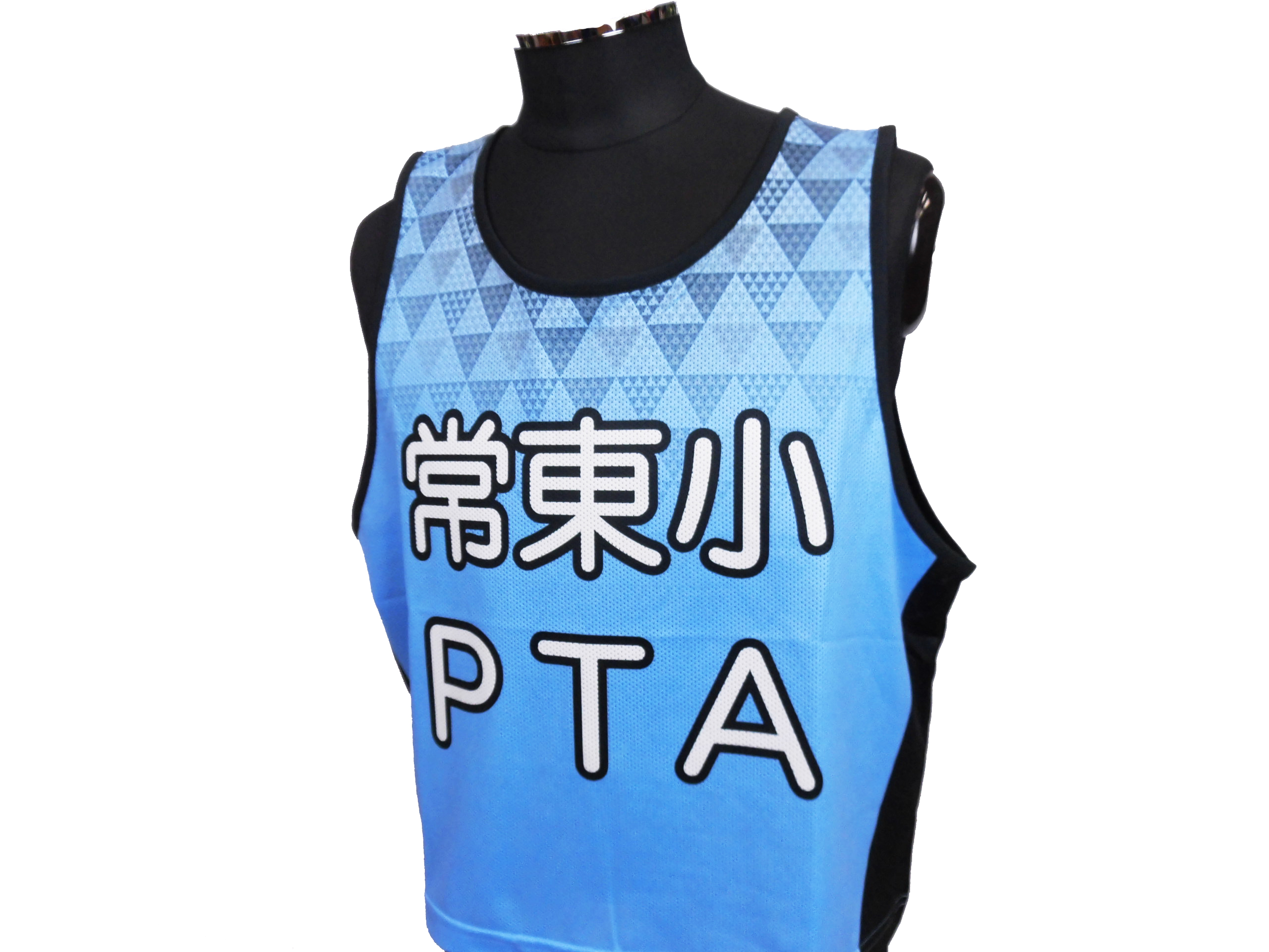 Blue mesh sport bib with geometric triangles and large white lettering displayed on a black mannequin form.