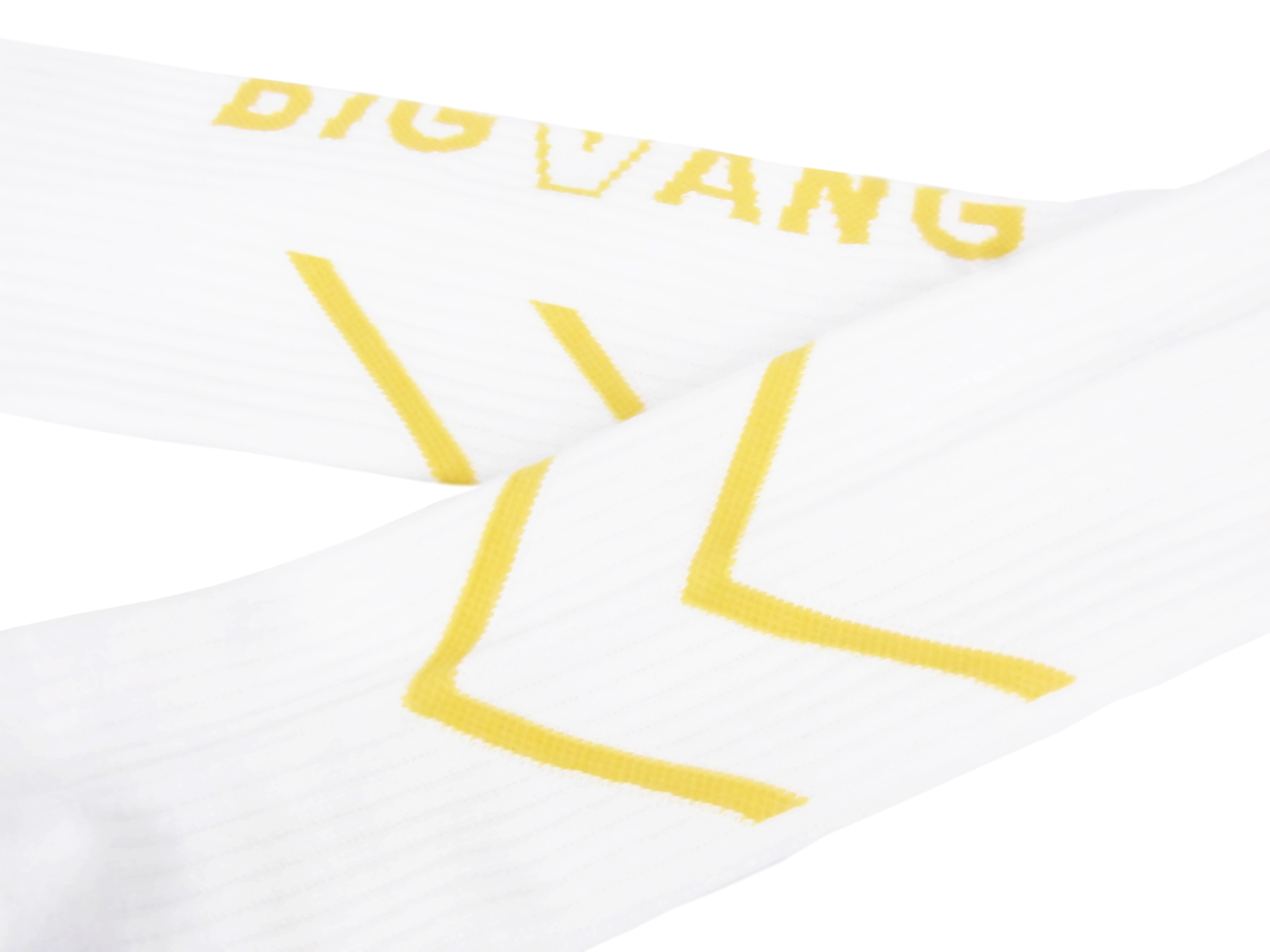 Close-up of white fabric with bold yellow stitching and diagonal folds/curves.